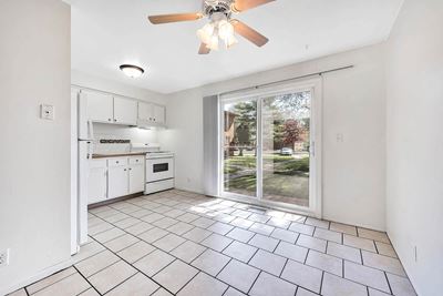 Upgraded White Cabinetry In Kitchen at Rivershell Apartments, Lansing, MI