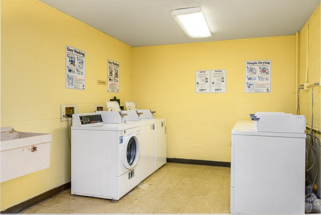 a laundry room with two washes and a washing machine