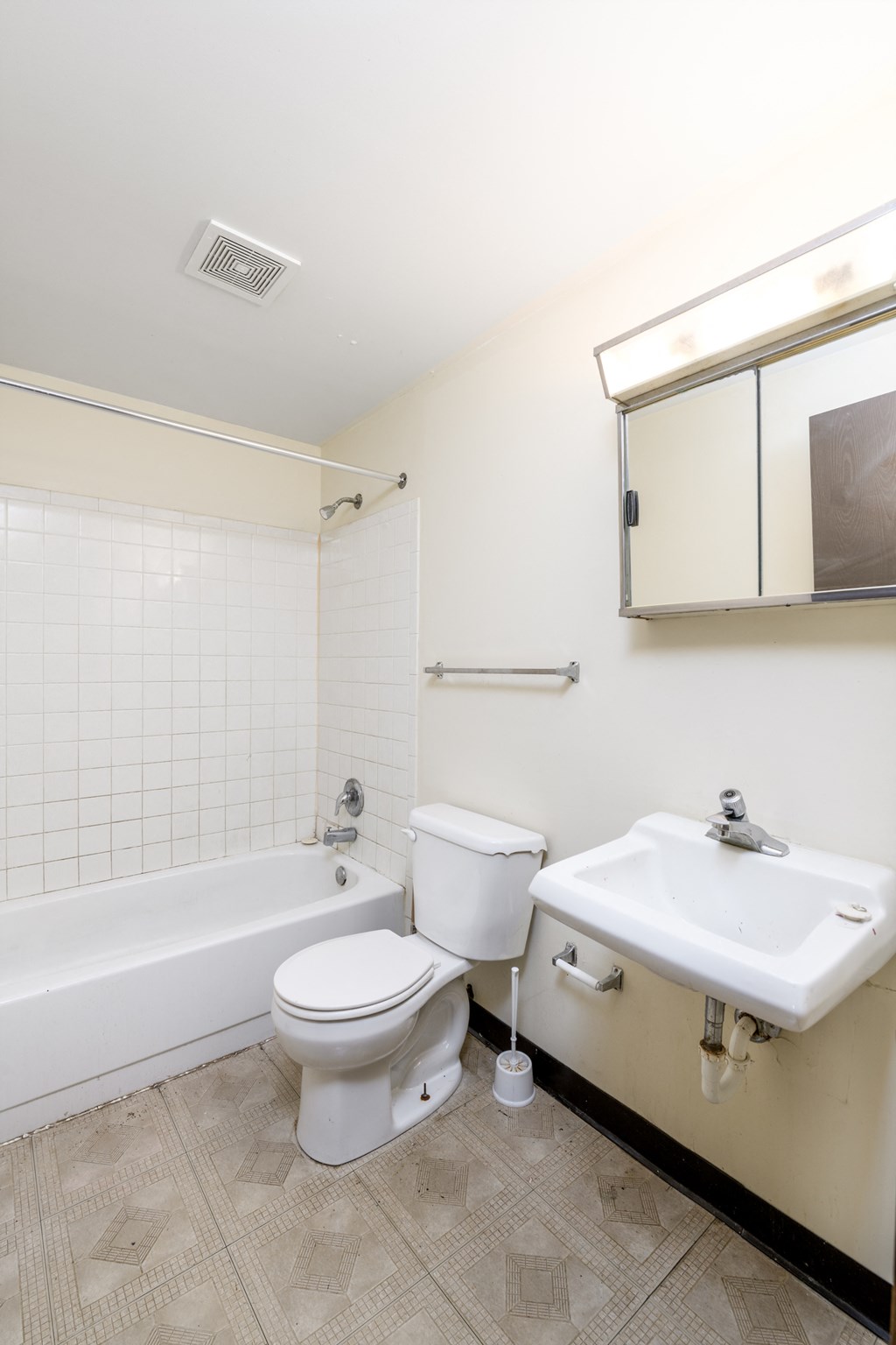 a bathroom with a sink toilet and bath tub