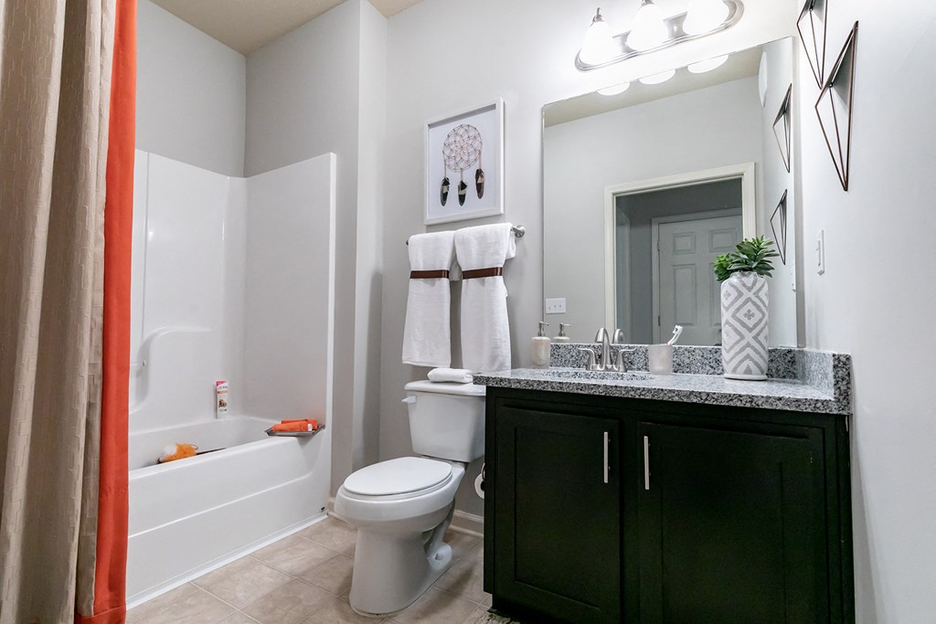 a bathroom with a sink toilet and a bath tub