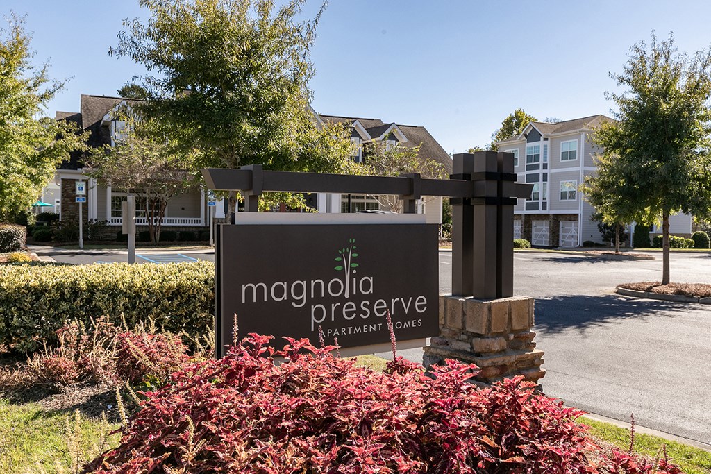 an exterior view of the magnolia preserve apartments entrance sign