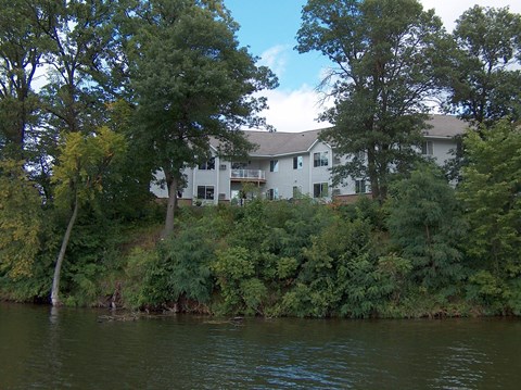 a house on the bank of a river