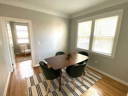 a dining room with a table and chairs