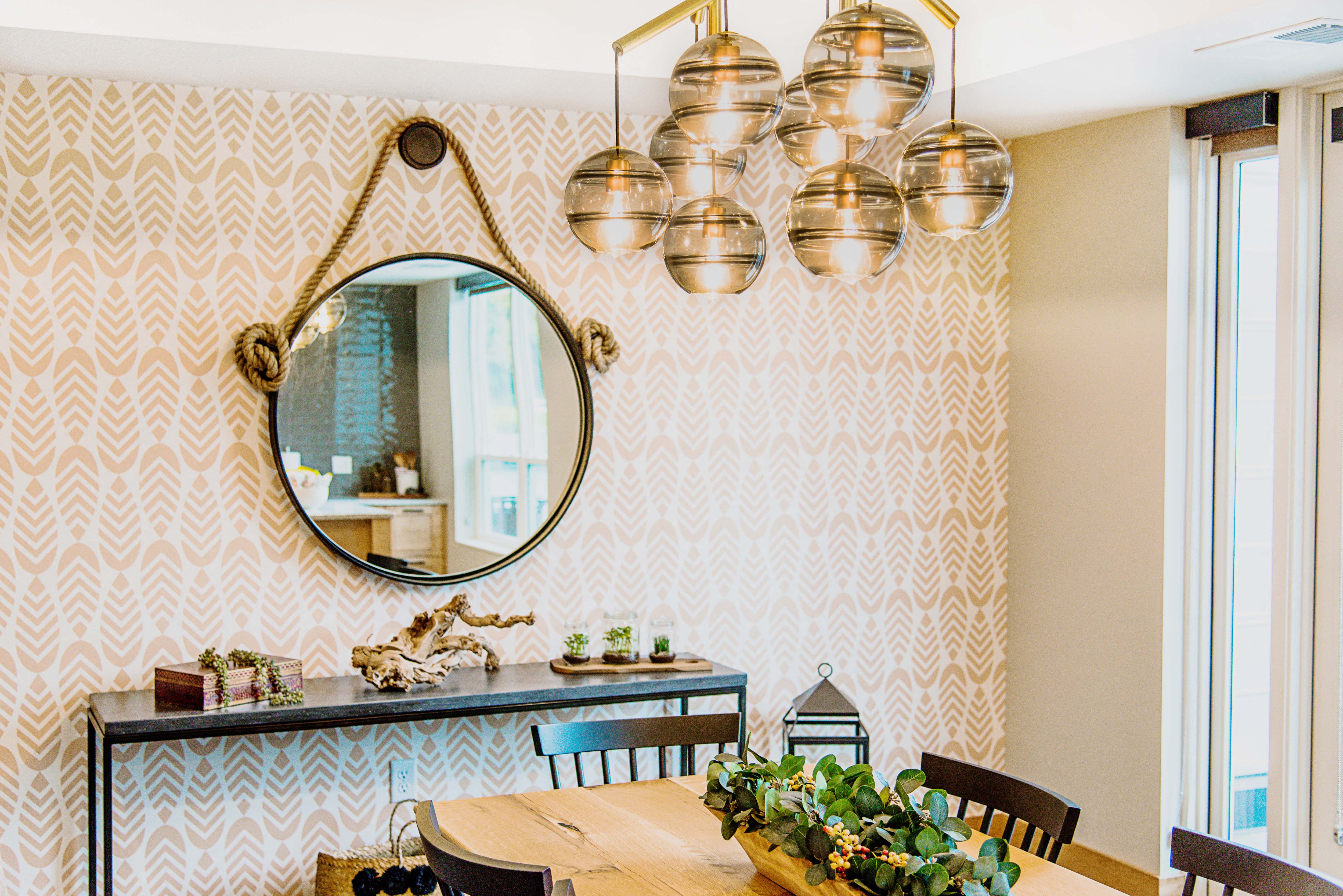 Cozy communal lounge in the apartment complex featuring stylish seating arrangements, a modern flat-screen TV, a warm fireplace, and a tabletop shuffleboard for residents to enjoy.