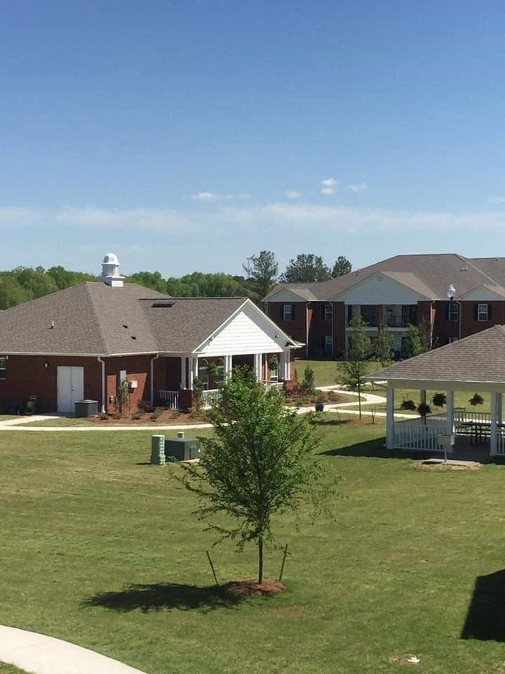 an aerial view of a neighborhood with houses and a lawn