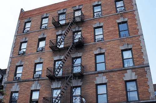a brick building with a fire escape