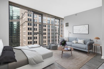 Studio unit with queen size bed and couch with table - Photo Gallery 5