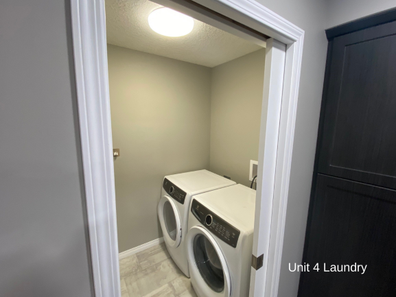 a laundry room with a washer and a dryer in it