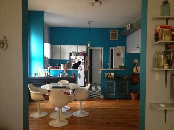 a kitchen with a table and chairs in it