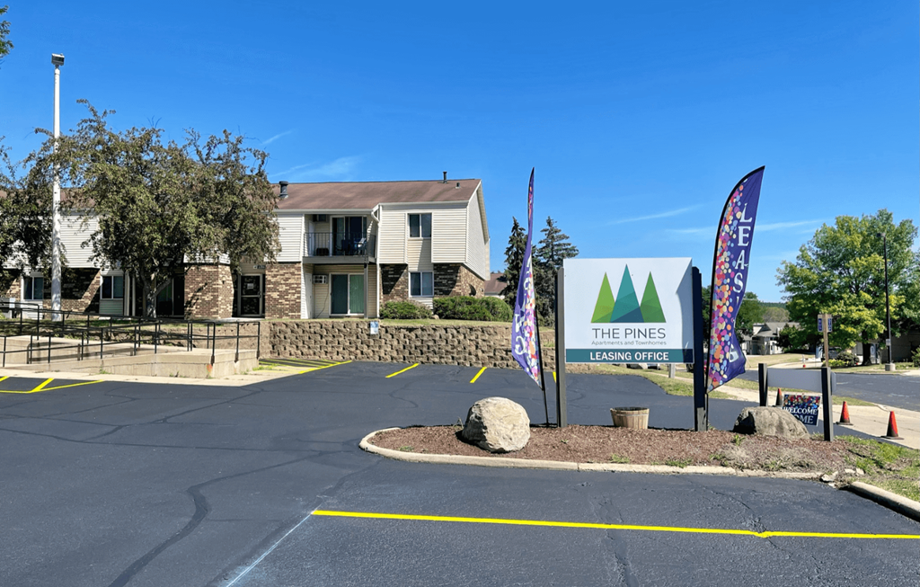 the rivers apartments sign in front of the building