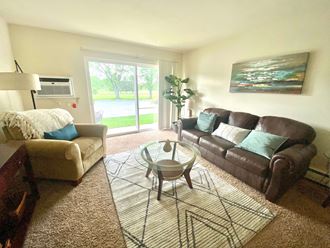 a living room with couches and a coffee table