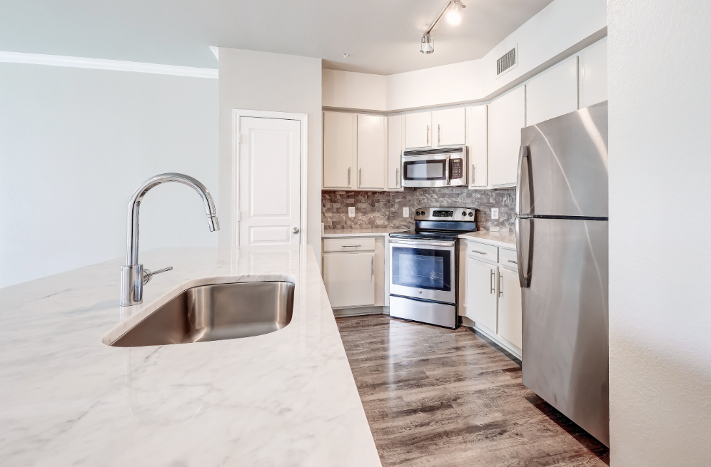 Marble countertops and deep garden kitchen sink