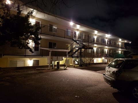 the building where the motel is located is lit up at night