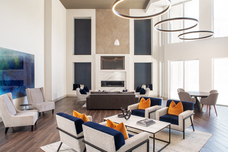 a living room with blue and white furniture and a fireplace