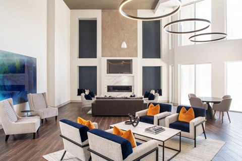 a living room with blue and white furniture and a fireplace