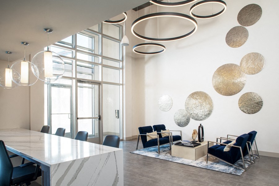 a conference room with blue chairs and a white table