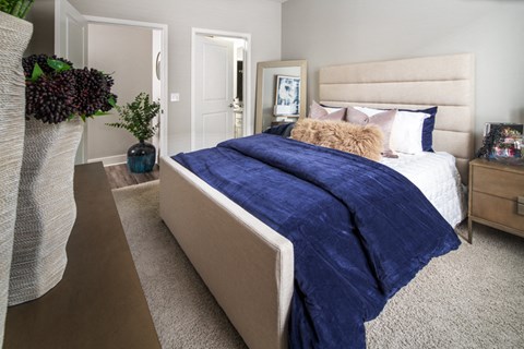 a bedroom with a bed and pillows on it