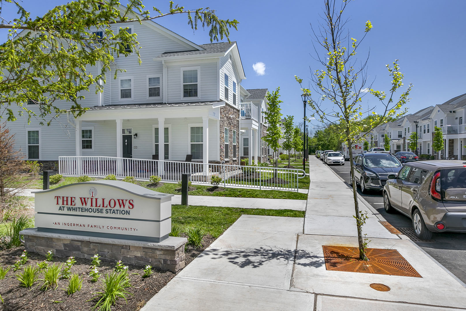 the willows neighborhood sign in front of a row of houses