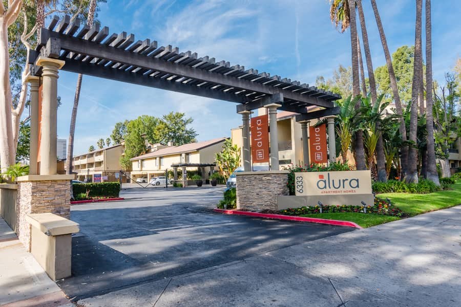 a building with a sign on the side of a road