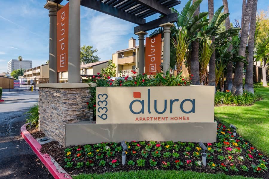 a sign apartment homes in front of a building