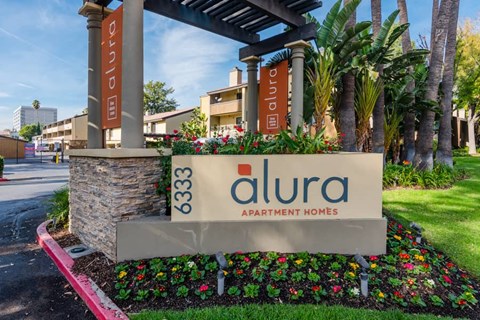 a sign apartment homes in front of a building
