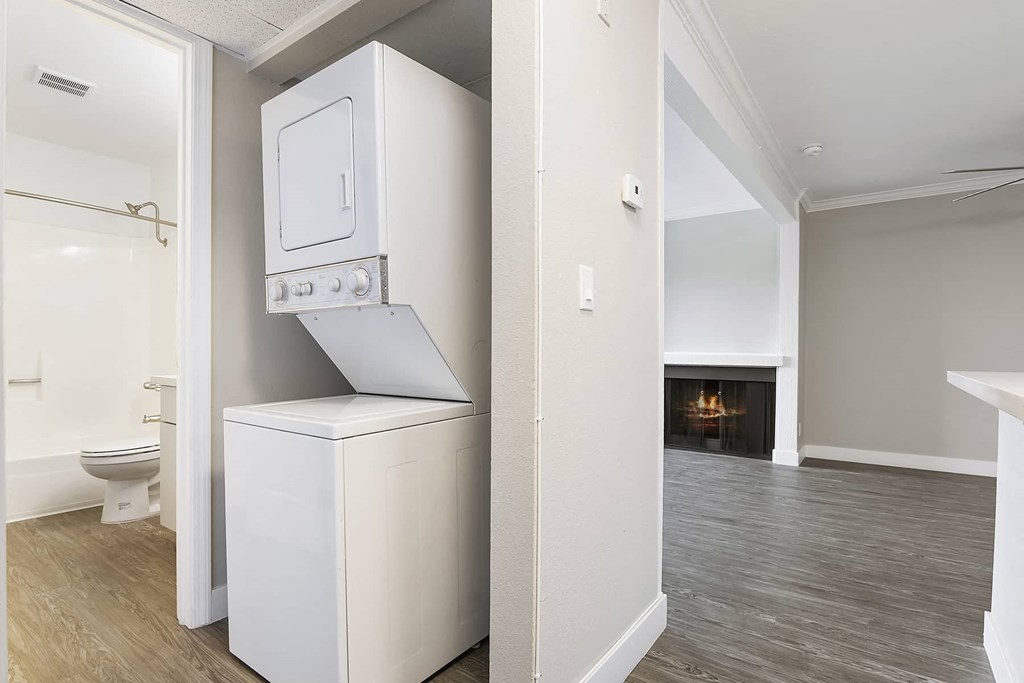 a laundry room with a washer and dryer in a house