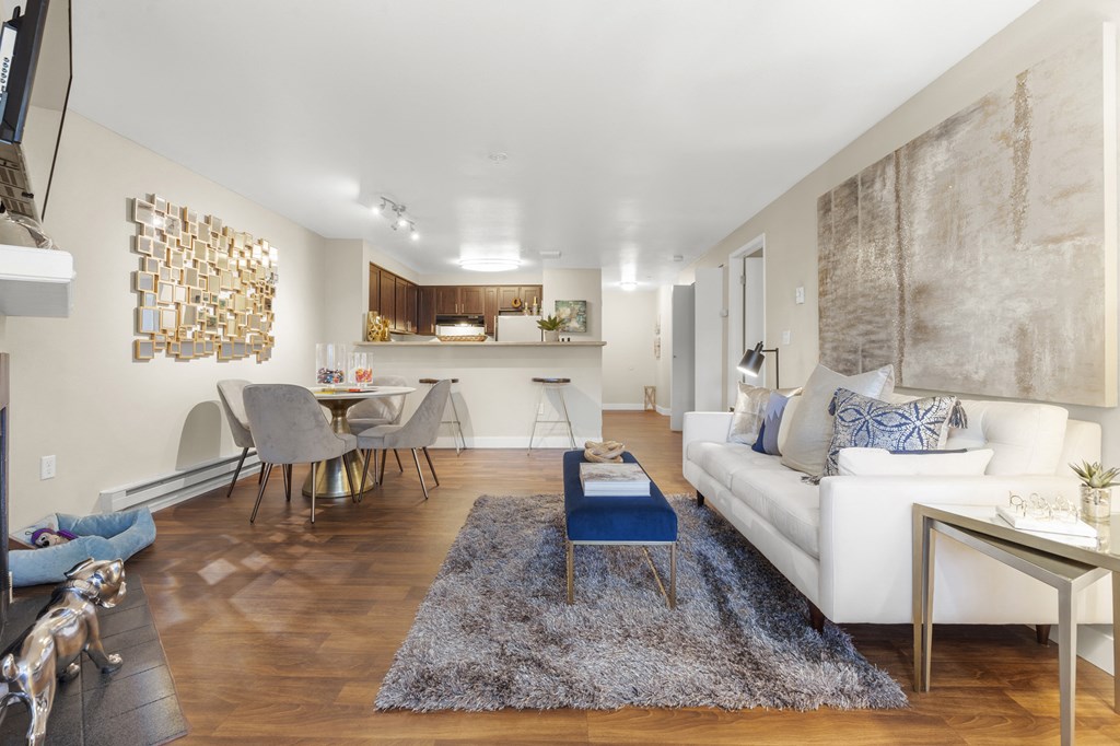 a living room and dining area with a couch and a table