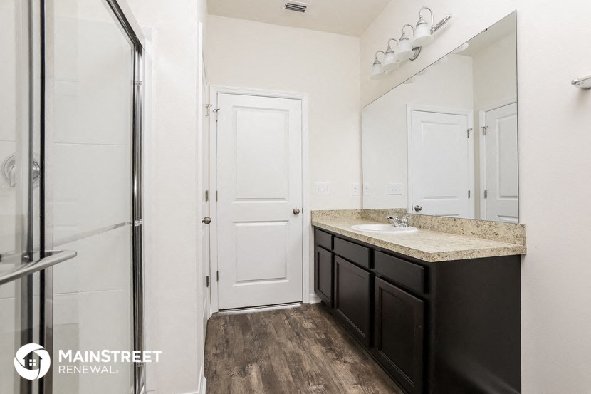 a bathroom with a sink and a shower