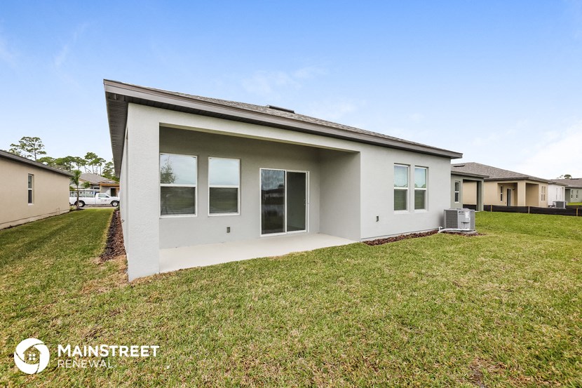 a small house with a lawn in front of it