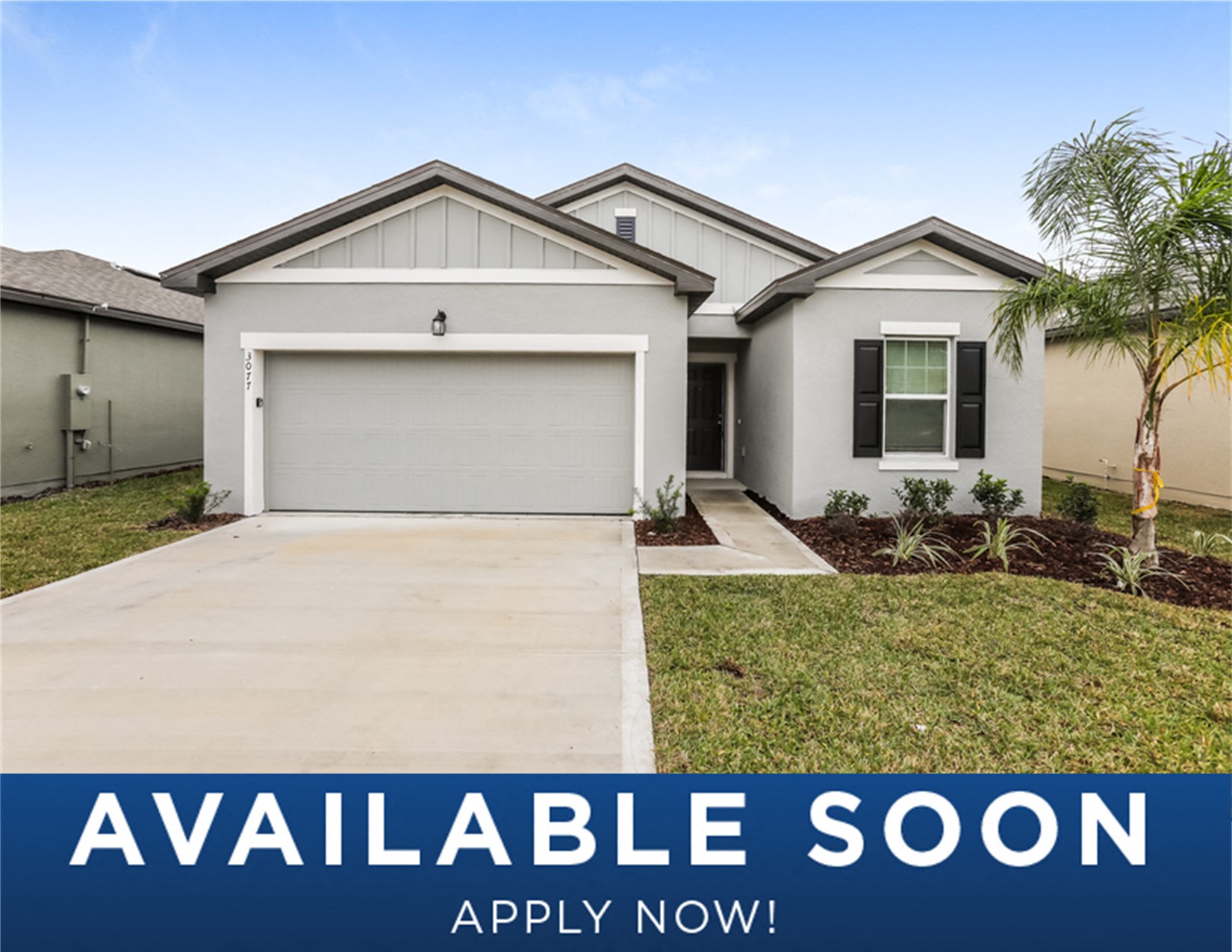 a white house with a driveway and a garage door