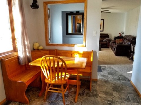 a dining room table and chairs in a living room