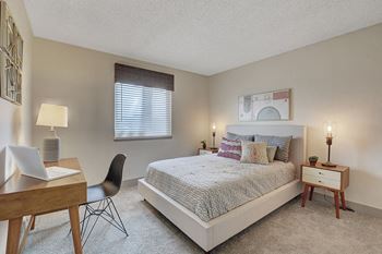 Bedroom With Expansive Windows at Namaste Apartments, Nevada, 89102