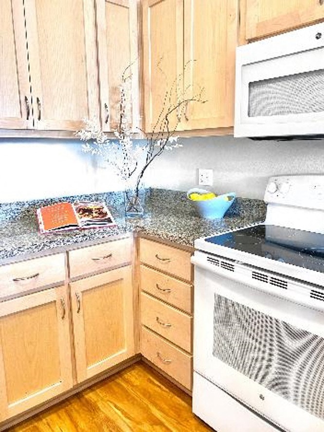 a kitchen with a stove and a counter top