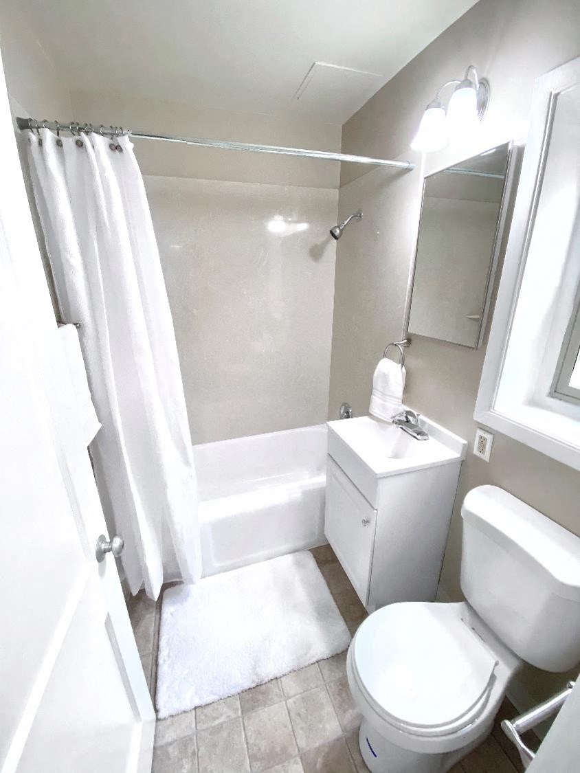 a small bathroom with a toilet and a shower