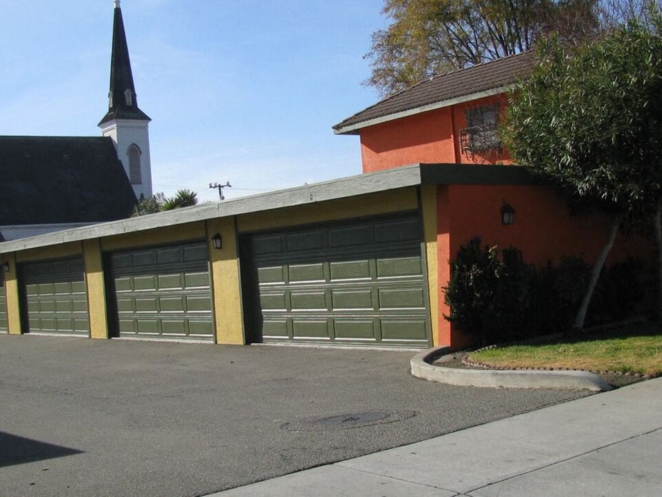 a garage door with a church in the background