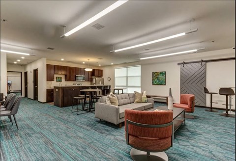 a clubhouse with a living room and a kitchen