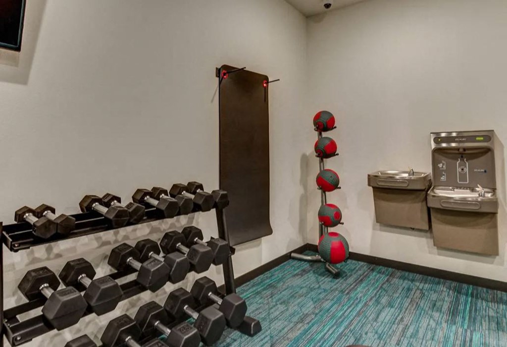 the gym with free weights and a vending machine