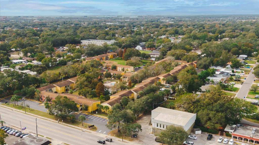 an aerial view of a city with buildings and trees