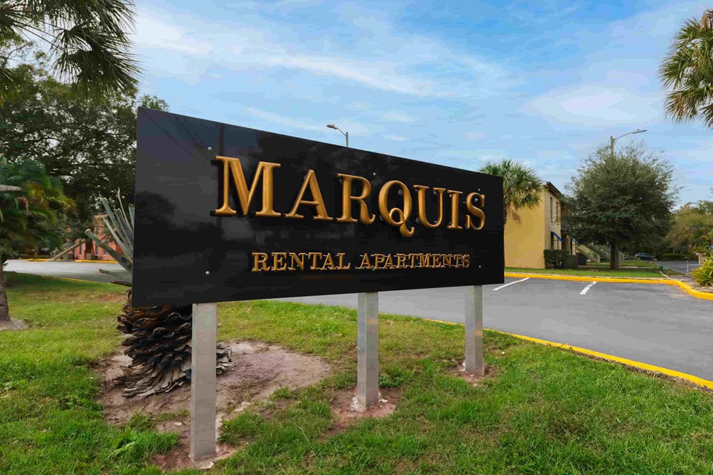 a sign formarcus rental apartments in front of a road