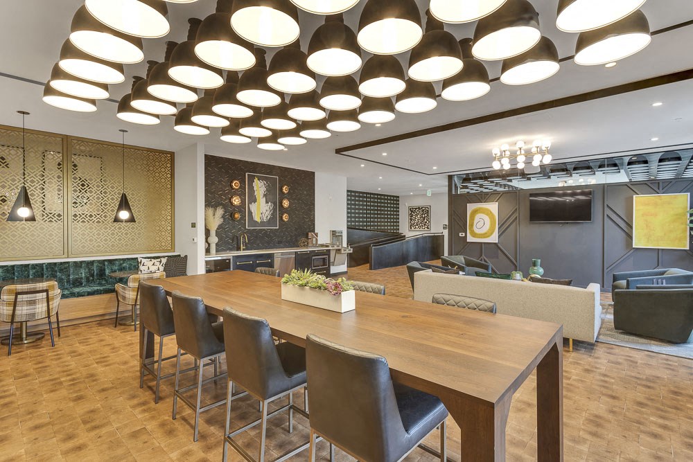 a conference room with a long wooden table and chairs