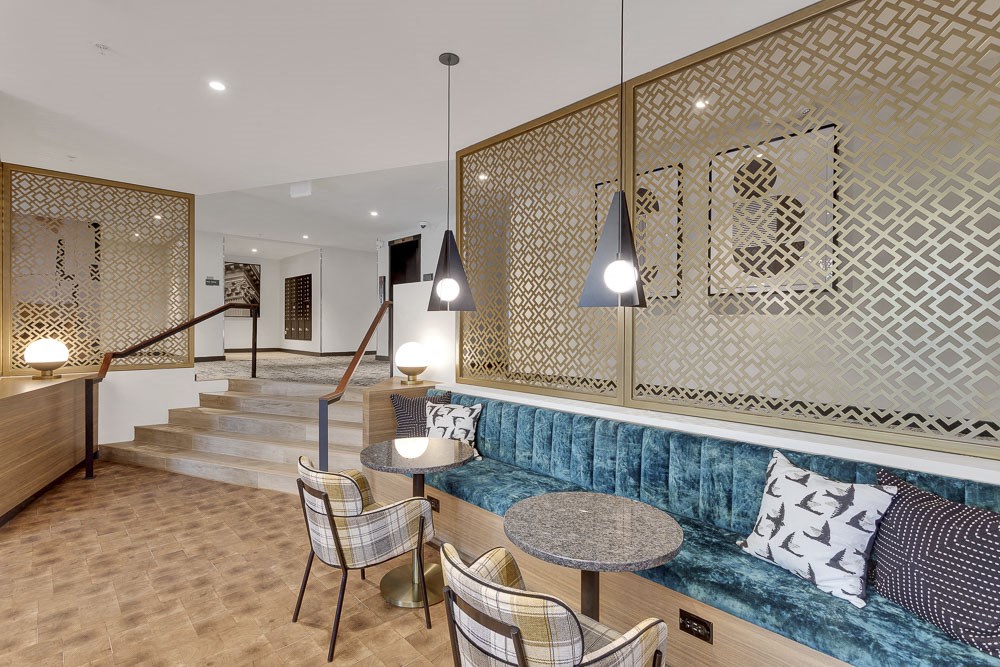 a living room with a couch and tables