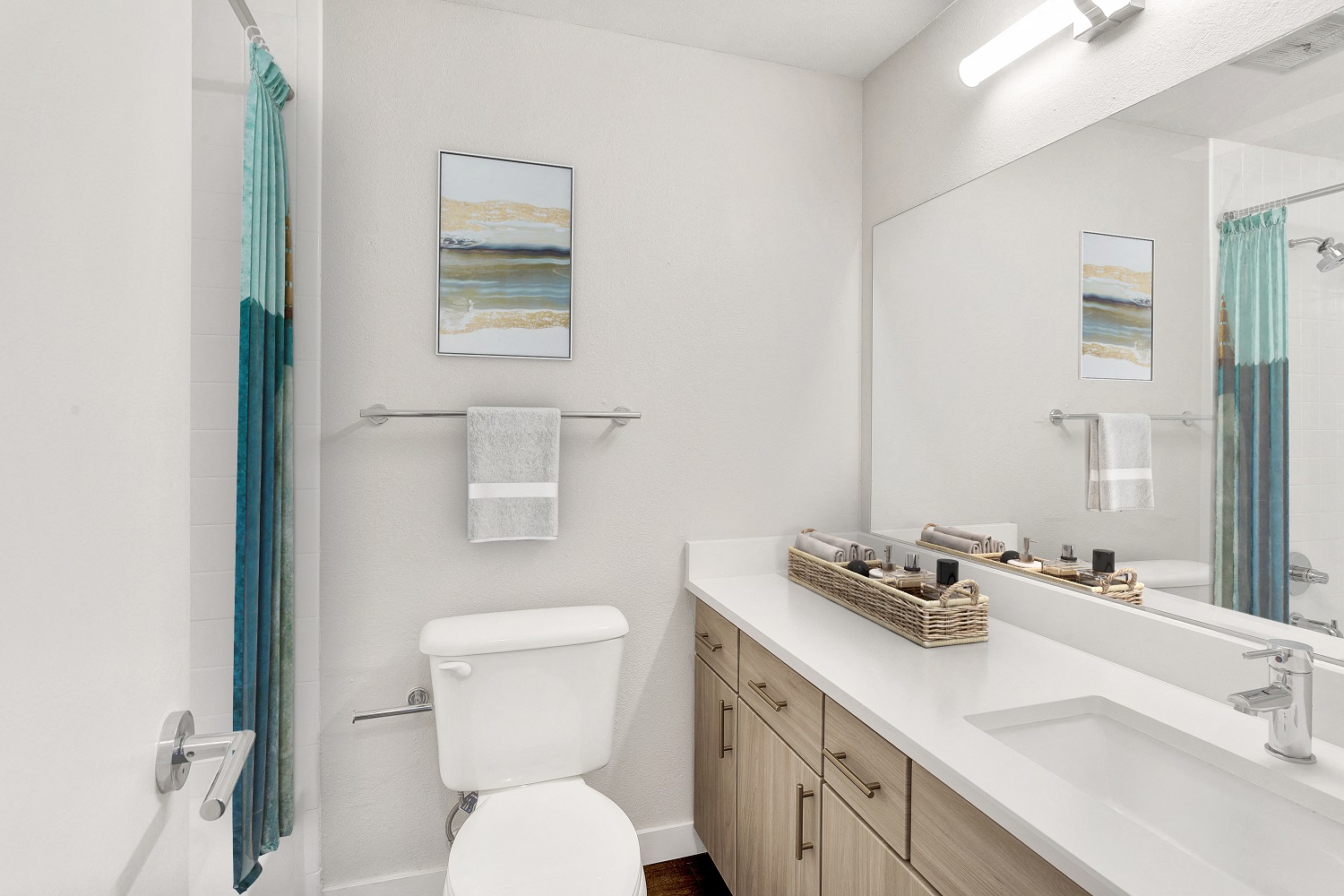 a bathroom with a mirror and a toilet and a sink