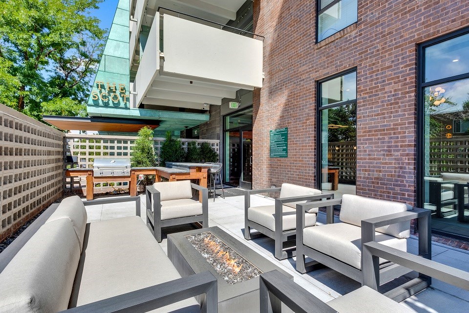 the reserve at city center spacious patio with chairs and a fire pit