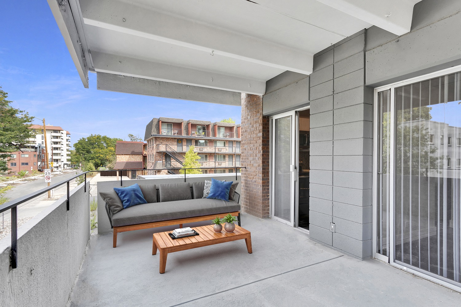 a balcony with a couch and a coffee table