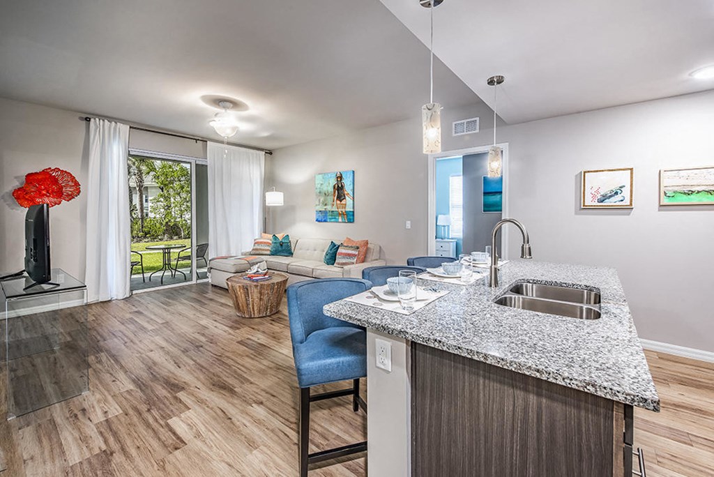 Coralina Apartments | Cape Coral, FL | Sleek Modern Kitchen with Granite Countertops