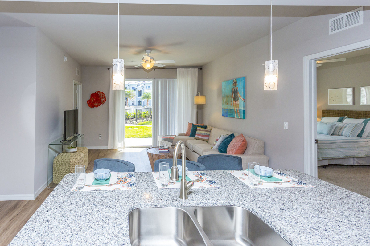 Coralina Apartments | Cape Coral, FL | Sleek Modern Kitchen with Granite Countertops