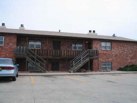 a red brick building with two sets of stairs
