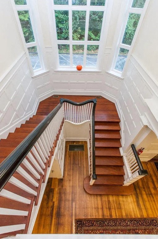 a view of a staircase in a house with a window