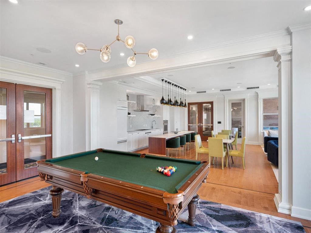 a pool table in the middle of a living room