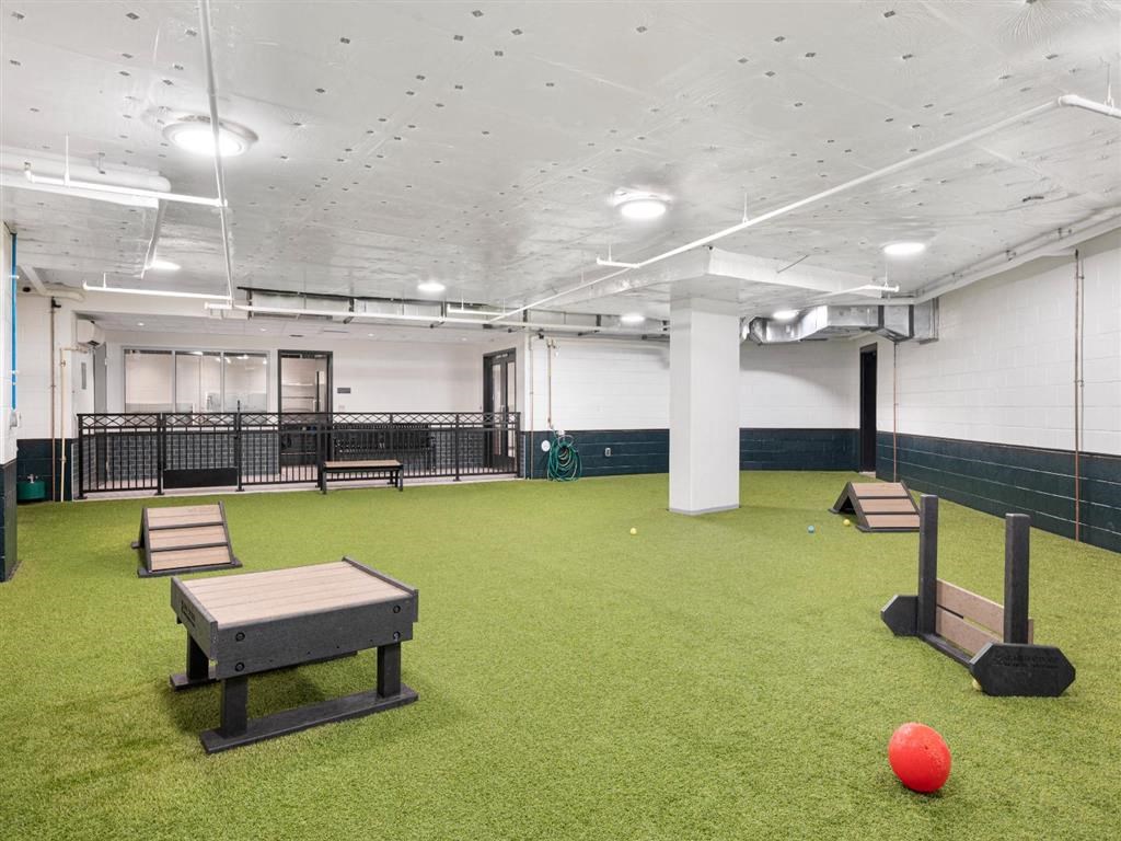 a gym with a bowling ball and a table
